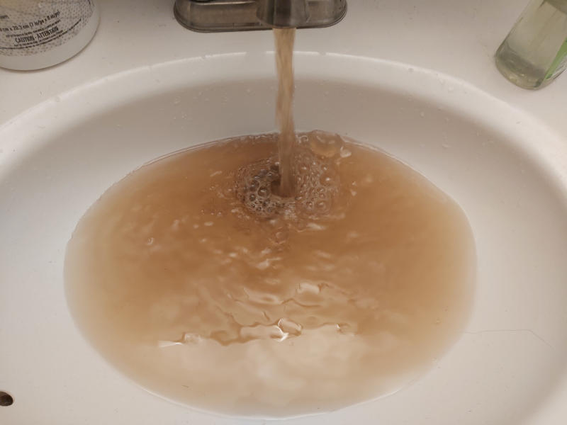 Brown water running into sink