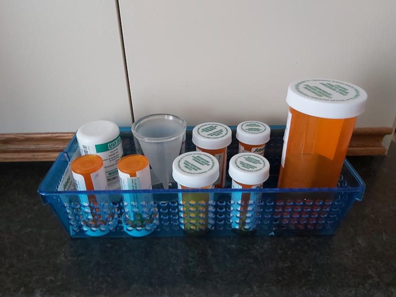 Picture of medications arranged in a small blue box